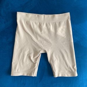 Free People Intimates tan spandex biker shorts.